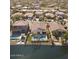 Aerial view of backyards showing pools and water views of homes in the neighborhood at 856 E Indian Wells Pl, Chandler, AZ 85249