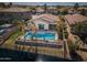 Aerial view showcasing a private pool, palm trees, and a well-maintained backyard oasis overlooking the canal at 856 E Indian Wells Pl, Chandler, AZ 85249