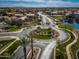 A scenic view of a landscaped community entrance with palm trees and well-maintained streets on a clear day at 856 E Indian Wells Pl, Chandler, AZ 85249