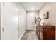 Inviting entryway with wood-look tile flooring, a decorative cabinet, and access to interior rooms at 856 E Indian Wells Pl, Chandler, AZ 85249