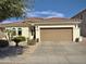 Charming single-story home with a well-maintained landscape, a two-car garage, and a tiled roof at 856 E Indian Wells Pl, Chandler, AZ 85249