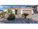 Lovely single-story home with mature landscaping, a tile roof, and a two-car garage, exuding warmth at 856 E Indian Wells Pl, Chandler, AZ 85249