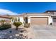 Charming single-story home with a well-manicured front yard and a two-car garage, creating curb appeal at 856 E Indian Wells Pl, Chandler, AZ 85249