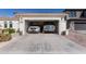 Spacious two-car garage featuring two parked vehicles at 856 E Indian Wells Pl, Chandler, AZ 85249