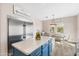 Bright and airy kitchen with an island featuring quartz countertop, stainless appliances, and a charming breakfast area at 856 E Indian Wells Pl, Chandler, AZ 85249