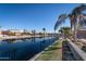 Beautiful lake view with the row of houses with the palm trees in the background at 856 E Indian Wells Pl, Chandler, AZ 85249