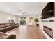 Bright living room with a sliding glass door, luxury flooring and a ceiling fan at 856 E Indian Wells Pl, Chandler, AZ 85249