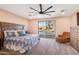 Spacious main bedroom featuring an oversized window with a pool view and stylish furnishings at 856 E Indian Wells Pl, Chandler, AZ 85249