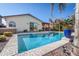 Inviting backyard pool with a built-in hot tub and lush landscaping, perfect for relaxing and entertaining at 856 E Indian Wells Pl, Chandler, AZ 85249