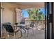 Balcony overlooking the property has a table and chairs for outdoor enjoyment at 9151 W Greenway Rd # 258, Peoria, AZ 85381