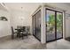 Dining Room has neutral tones, tile floor, modern chandelier and a sliding door to a patio at 9151 W Greenway Rd # 258, Peoria, AZ 85381