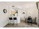 Bright kitchen and dining area featuring tile floors, a breakfast bar, and pendant lighting at 9151 W Greenway Rd # 258, Peoria, AZ 85381