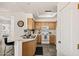 Well-lit kitchen showcasing ample cabinet space, tile flooring, and modern appliances at 9151 W Greenway Rd # 258, Peoria, AZ 85381