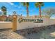 Greenway Palms Condominiums signage surrounded by desert landscaping, creating an inviting entrance at 9151 W Greenway Rd # 258, Peoria, AZ 85381