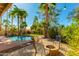 Backyard with pool, beautiful foliage, fire pit, and patio furniture; perfect for outdoor entertaining at 9214 N 83Rd St, Scottsdale, AZ 85258