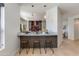 Contemporary kitchen with breakfast bar, pendant lighting, and open layout at 9214 N 83Rd St, Scottsdale, AZ 85258