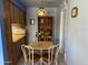 Comfortable dining area with seating for four and a charming stained-glass pendant light overhead at 925 E Lancaster Cir, Florence, AZ 85132