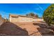 Backyard featuring desert landscaping and an air conditioning unit at 9283 W Rafael Dr, Arizona City, AZ 85123