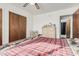 Bedroom featuring a closet, dresser, and a comfortable bed with a patterned blanket at 9283 W Rafael Dr, Arizona City, AZ 85123