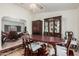 Elegant dining room featuring classic wood furniture and a decorative rug at 9283 W Rafael Dr, Arizona City, AZ 85123