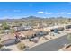 Stunning aerial view of desert home with mountain backdrop, blue skies, and well-maintained landscaping at 9410 N 18Th St, Phoenix, AZ 85020