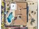 Aerial view of a desert home with pool, patio, desert landscaping and surrounding neighborhood at 9410 N 18Th St, Phoenix, AZ 85020