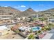 Private backyard oasis featuring a sparkling pool and an elevated patio, perfect for entertaining in this desert home at 9410 N 18Th St, Phoenix, AZ 85020