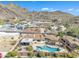 Desert home features a private pool, patio, desert landscaping and stunning views of the surrounding mountain landscape at 9410 N 18Th St, Phoenix, AZ 85020