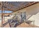 Comfortable seating area on a spacious back patio with a decorative pergola, lush landscaping, and mountain views at 9410 N 18Th St, Phoenix, AZ 85020