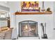 Close-up of a charming fireplace with unique design features and a rustic mantel at 9410 N 18Th St, Phoenix, AZ 85020