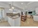 Modern kitchen with white cabinets, granite countertops, stainless steel appliances, and an island with a cooktop at 9410 N 18Th St, Phoenix, AZ 85020