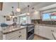 Beautiful kitchen with stainless steel appliances, granite countertops, and a view of the pool at 9410 N 18Th St, Phoenix, AZ 85020