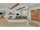 Cozy living room featuring a fireplace, wood beams, and comfortable seating at 9410 N 18Th St, Phoenix, AZ 85020