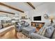 Spacious living room with wood beam accents, fireplace and an open floor plan at 9410 N 18Th St, Phoenix, AZ 85020