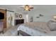 Main bedroom features a ceiling fan, neutral paint, and an ensuite bathroom with closet access at 9410 N 18Th St, Phoenix, AZ 85020