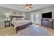 Main bedroom features neutral paint, ceiling fan, and access to the outdoor living area at 9410 N 18Th St, Phoenix, AZ 85020