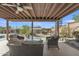 Relaxing outdoor patio area with comfortable seating and a spiral staircase with beautiful desert landscape at 9410 N 18Th St, Phoenix, AZ 85020