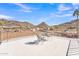 Relaxing rooftop deck area with seating and a table, showcasing stunning mountain and city views at 9410 N 18Th St, Phoenix, AZ 85020