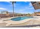 Inviting pool with desert landscaping, a diving board, patio with a shaded pergola, and mountain views at 9410 N 18Th St, Phoenix, AZ 85020