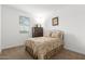 Cozy bedroom featuring a queen bed, carpet floors, and natural light at 9610 E Trent Ave, Mesa, AZ 85212