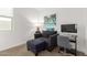 Bedroom featuring an accent chair, desk, and natural light at 9610 E Trent Ave, Mesa, AZ 85212