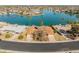 A high altitude, aerial view shows many waterfront homes that have personal docks at 10116 W Bolivar Dr, Sun City, AZ 85351