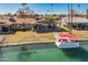Aerial view of home with backyard canal access and boat dock at 10116 W Bolivar Dr, Sun City, AZ 85351