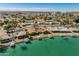 Wonderful aerial view of waterfront properties with docks and boats on a sunny day at 10116 W Bolivar Dr, Sun City, AZ 85351