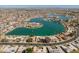 A high altitude, aerial view shows many waterfront homes that have personal docks at 10116 W Bolivar Dr, Sun City, AZ 85351