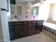 Bathroom vanity features a large mirror and soaking tub with decorative tile accents at 10116 W Bolivar Dr, Sun City, AZ 85351