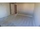 Bright bedroom featuring new carpeting and built in cabinets for ample storage at 10116 W Bolivar Dr, Sun City, AZ 85351