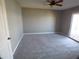 Comfortable bedroom offers plush carpeting and direct access to outdoor patio at 10116 W Bolivar Dr, Sun City, AZ 85351
