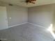 Cozy bedroom featuring neutral carpet and ample natural light, freshly painted at 10116 W Bolivar Dr, Sun City, AZ 85351