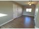 Cozy bedroom with ceiling fan, laminate flooring, a bright window and neutral paint at 10116 W Bolivar Dr, Sun City, AZ 85351